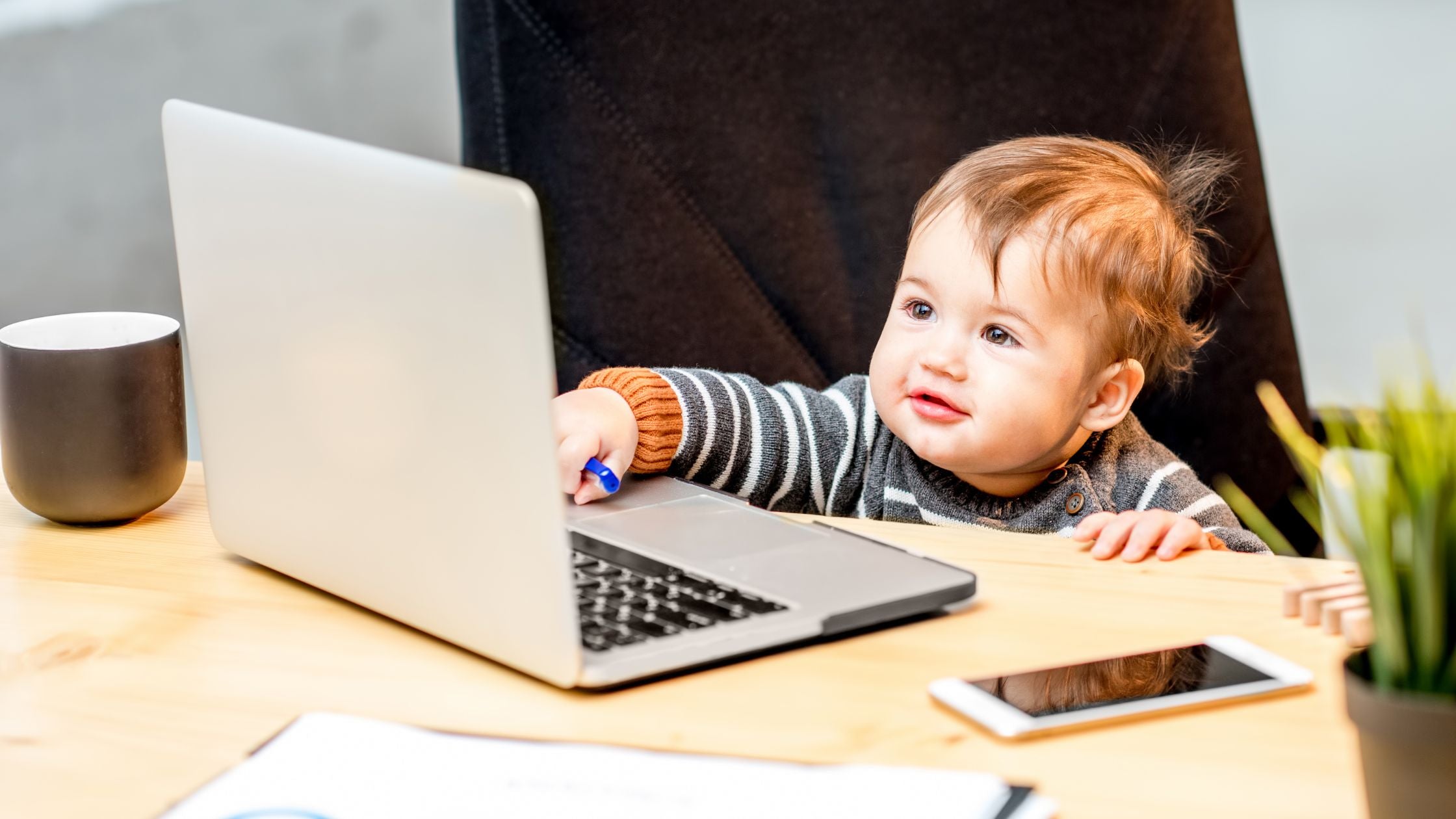 Baby playing with computer | Organic Formula Hub